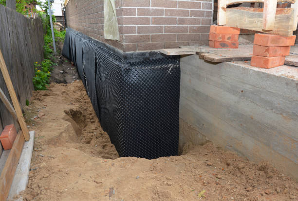 SJ Waterproofing Pros technician performing targeted Waterproofing assessment in Wayne, PA